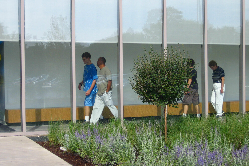Parents and student walking at The Cove School.